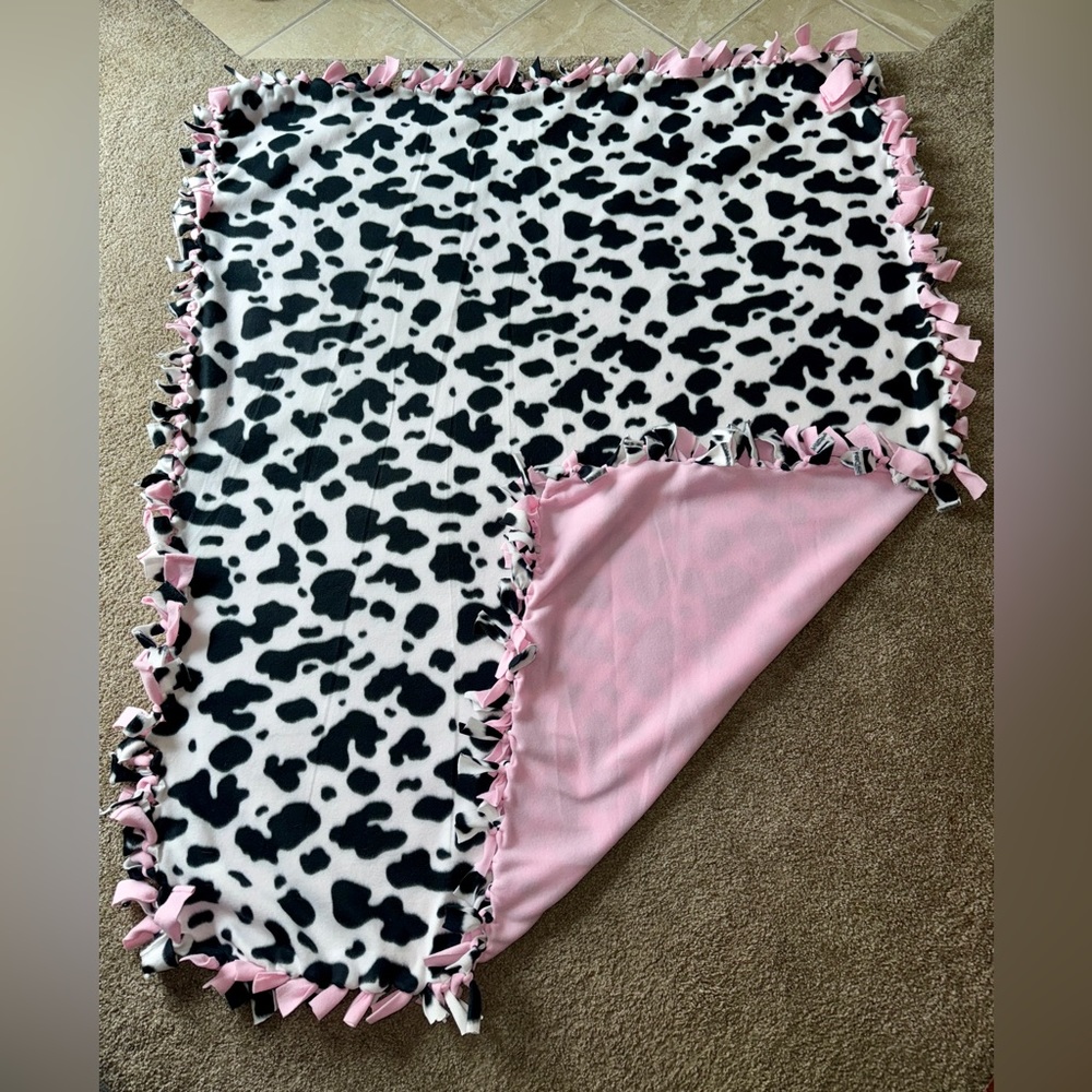 Cow print tie blanket
